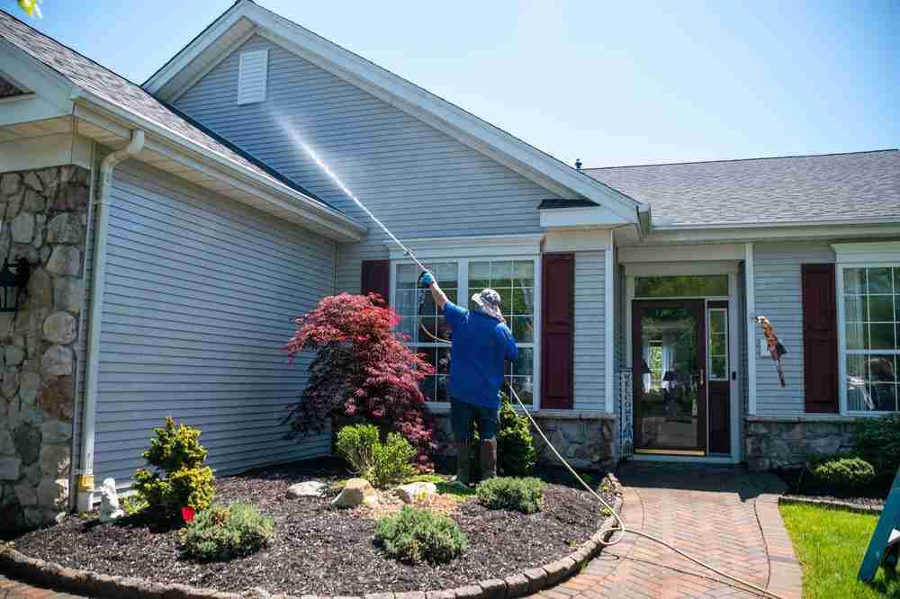 Pressure washing siding